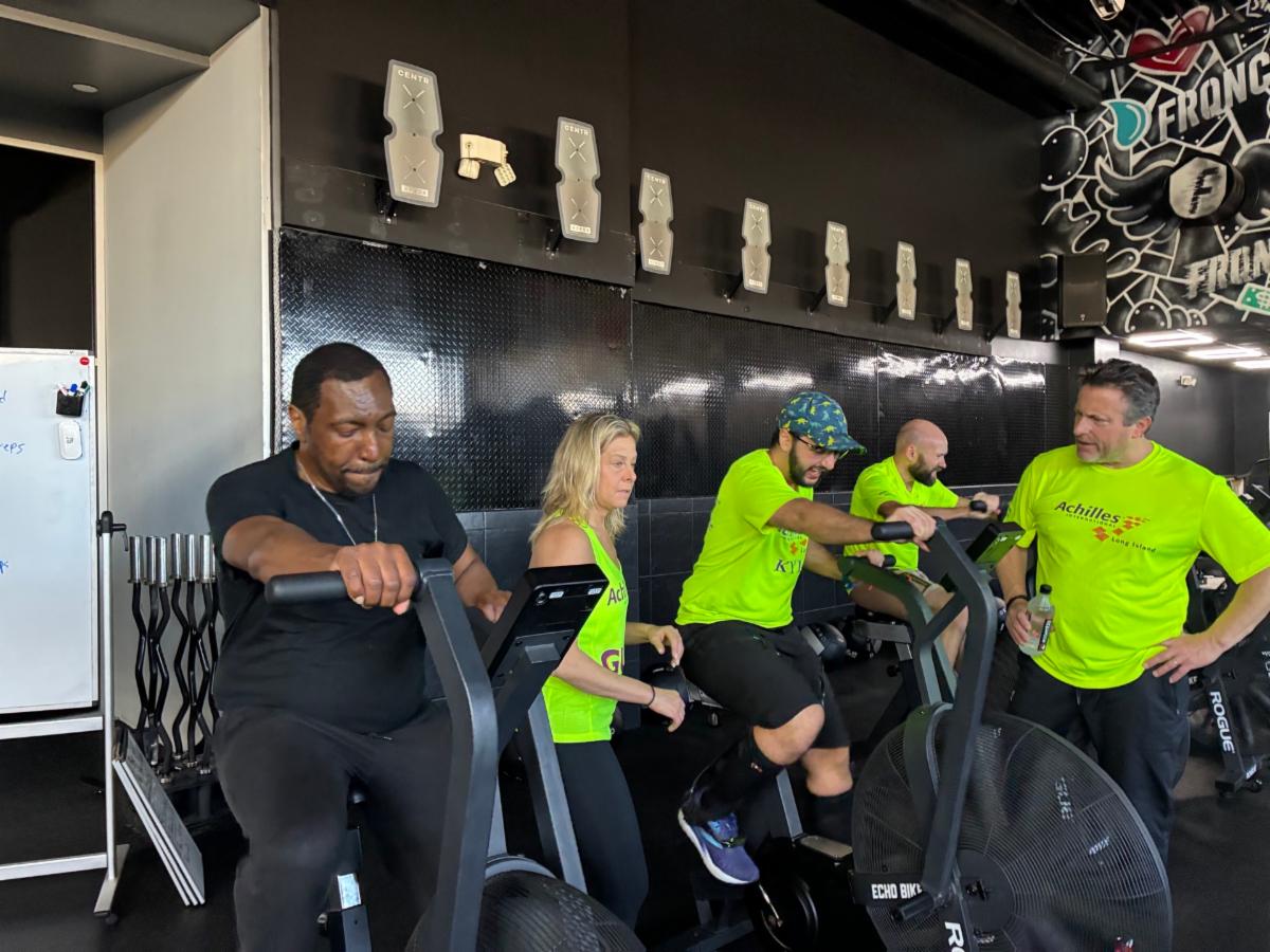 Kyle and Roosevelt on the stationary bikes