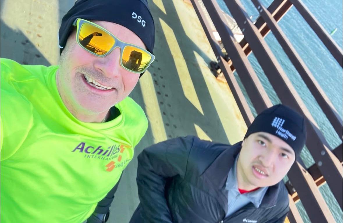 Athlete and Guide taking a selfie during a run